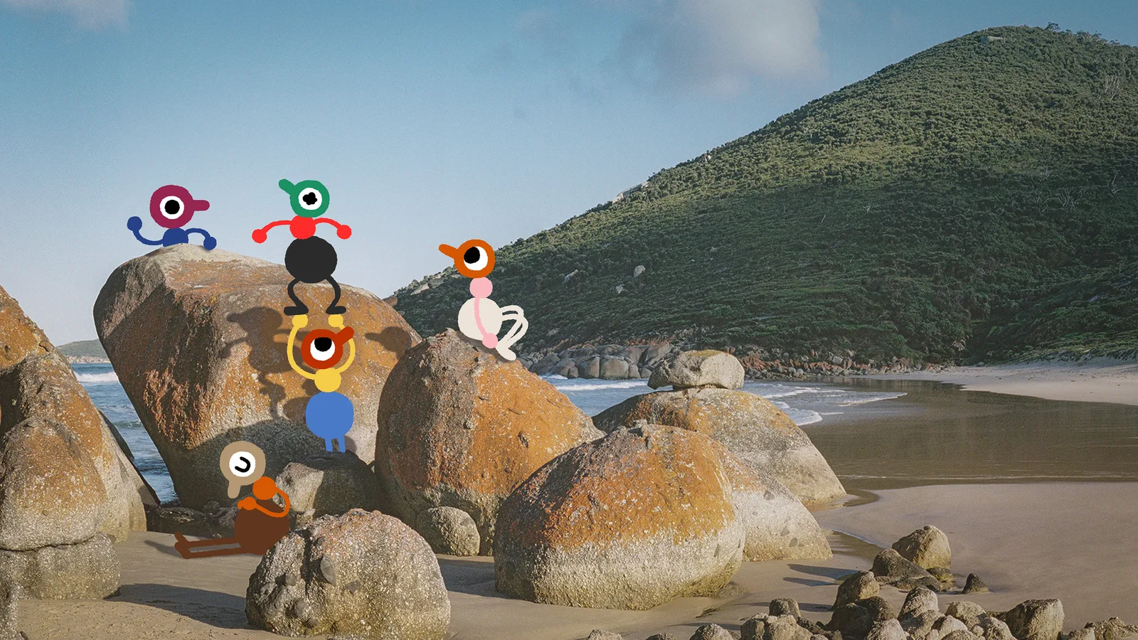Colorful characters gathered among coastal boulders